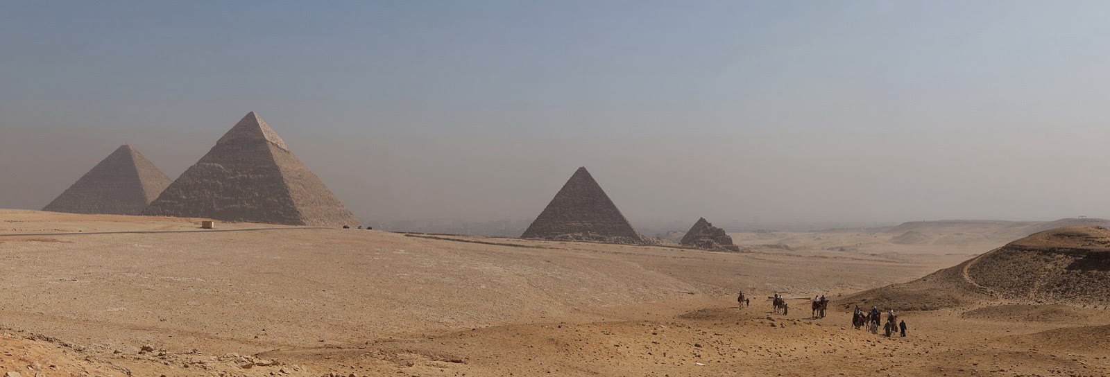 The pyramids of Giza spread across the desert plateau
